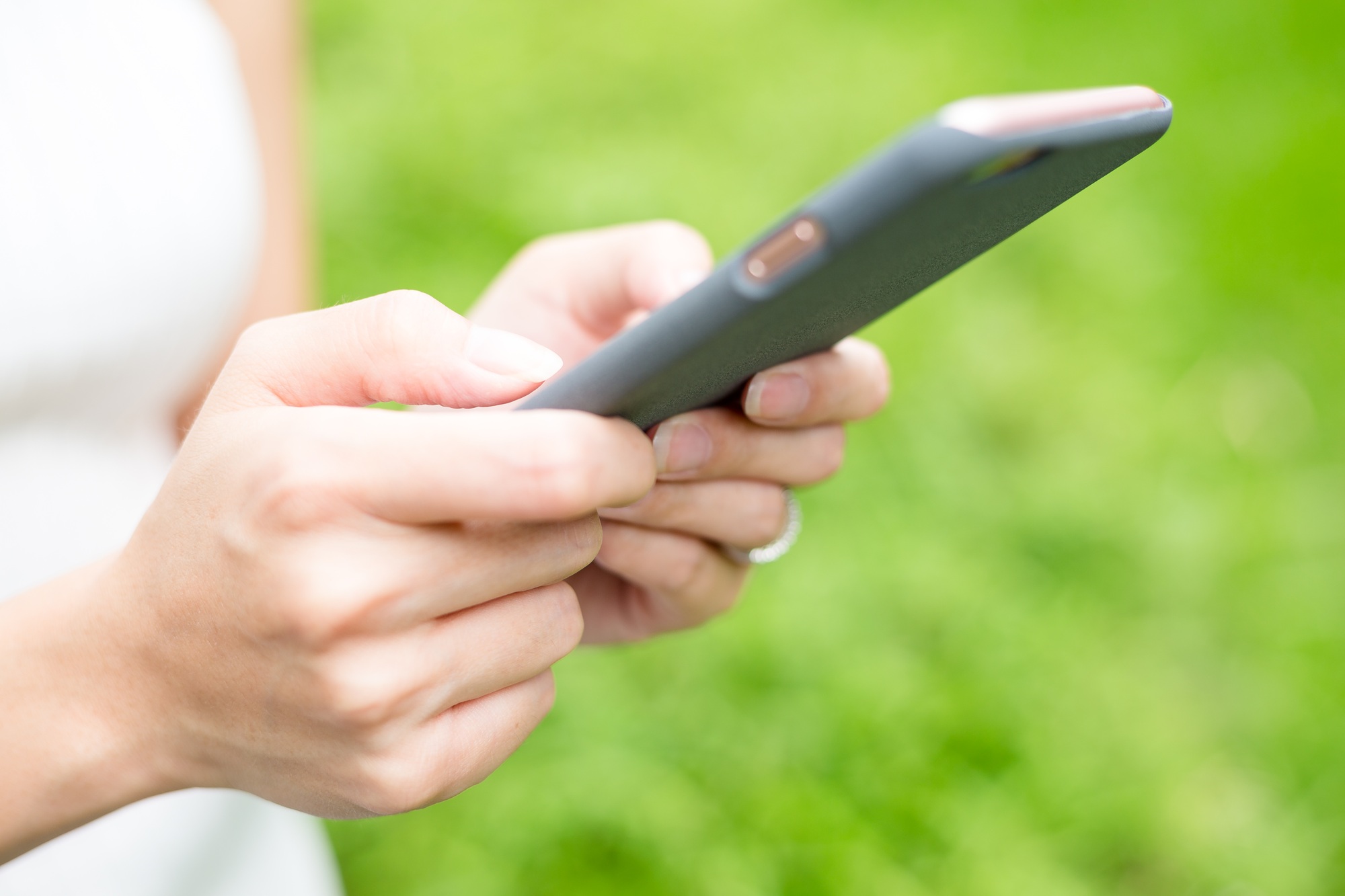 Woman sending sms on mobile phone