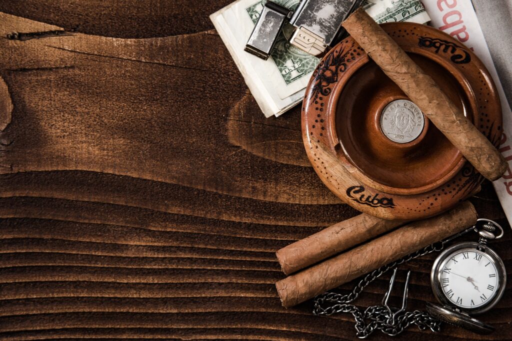 Cuban items,cigars watch on wooden table