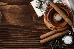 Cuban items,cigars watch on wooden table